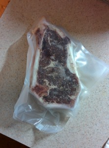 A steak, wrapped, seasoned, ready to cook and frozen.
